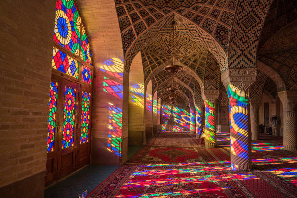 Nasir Al-Mulk Mosque (Pink Mosque) in Shiraz, Iran Colorful light through stained glass window inside Nasir Al-Mulk Mosque (Pink Mosque), a traditional mosque in Shiraz, Iran. shiraz stock pictures, royalty-free photos & images