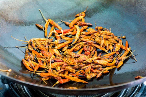 Peppers in a hot iron pan Food