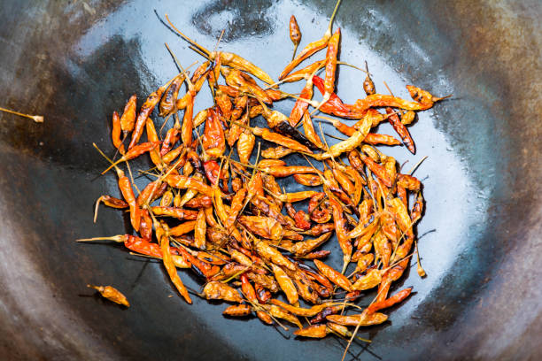 Peppers in a hot iron pan Food