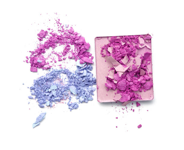 istock Pink purple and blue crushed eyeshadow on white background 648084558