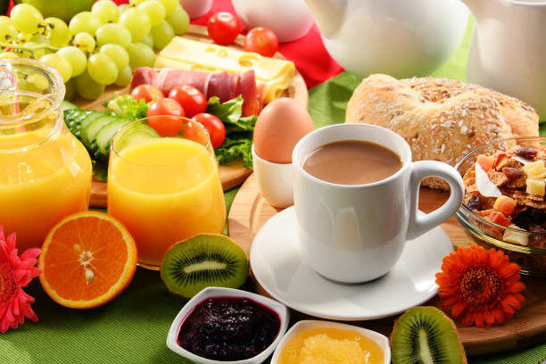 istock Breakfast served with coffee, orange juice, egg and fruits 648087494
