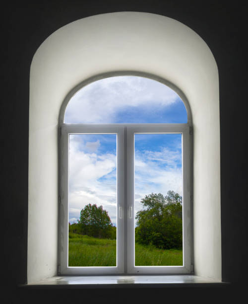 istock white semicircular modernist windows on a black wall
summer, sky, clouds, trees, grass, meadow in the window 648095450