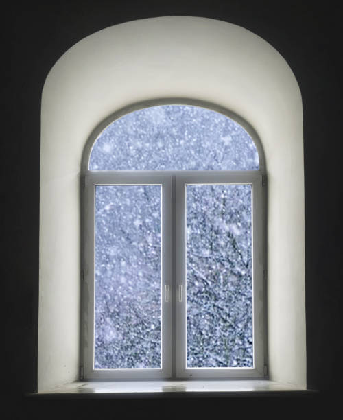 istock white semicircular modernist windows on a black wallwinter, snow, snowstorm, snowfall in the window 648095468