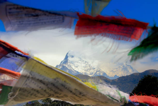Prayer flags in the first daylight, taken on Poon Hill near Ghorepani in the Annapurna Conservation area in Nepal.
