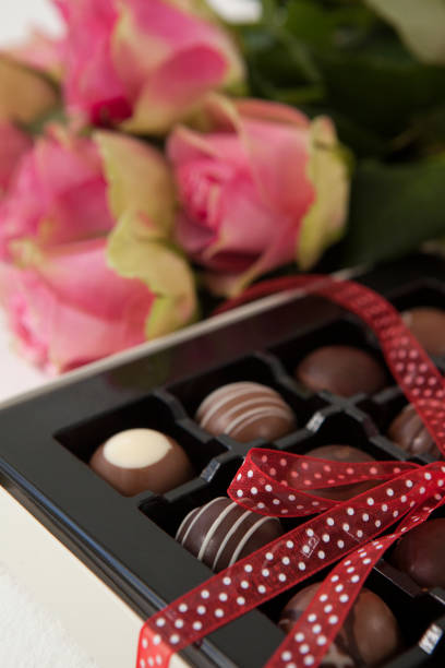 istock Bunch of roses and assorted chocolate box 648112398