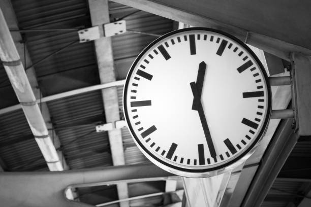 istock Black and white toned image of clock at train station. 648113298