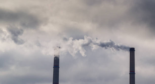 istock Industrial pollution and smoke from coal burning plant 648114050