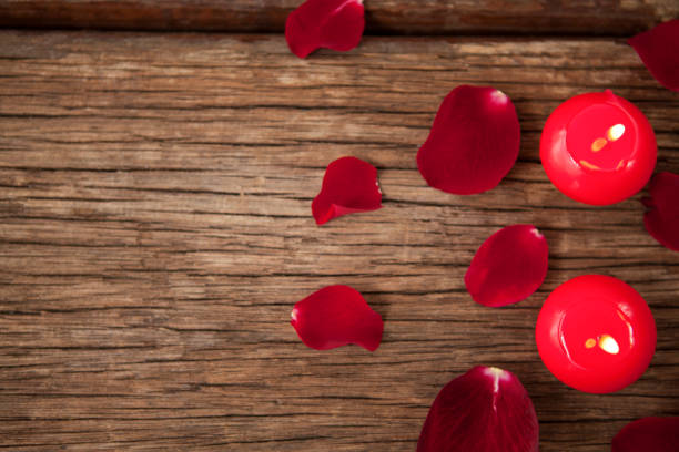 glasses with rose petals on a white background