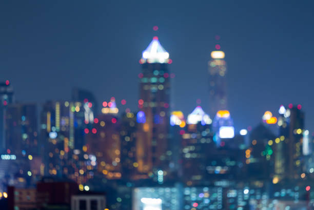 istock Night blurred bokeh light office building with twilight sky 648122652