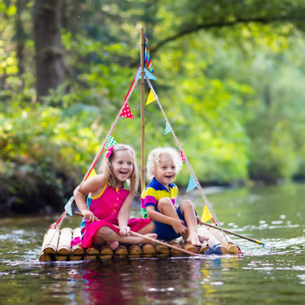 istock Kids on wooden raft 648122706