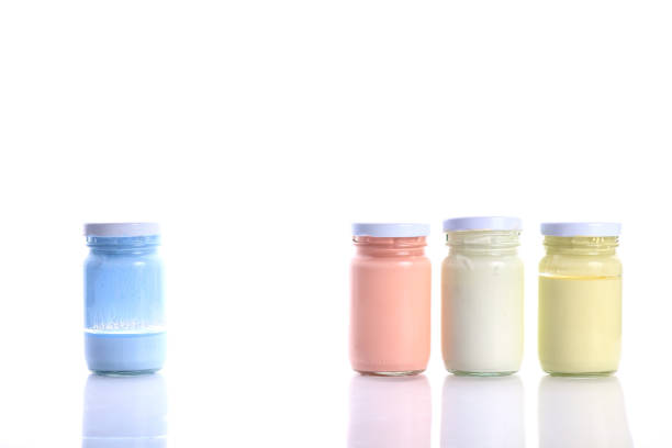 istock bottle glass of color on white background 648122852