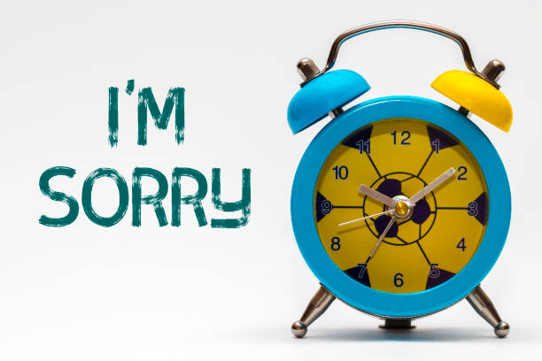 istock I'm sorry on a white background. Retro alarm clock 648126356