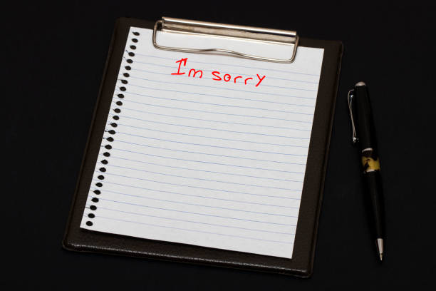 istock white paper and pen on black table 648126376