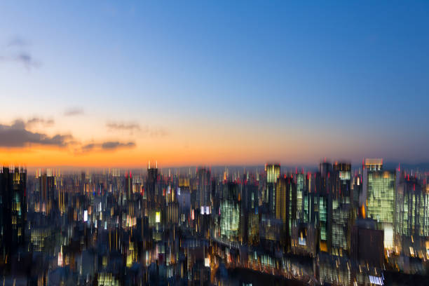 istock Blurred light city aerial view with sunset sky 648129830