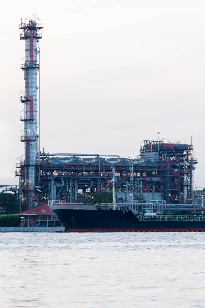 istock Oil refinery power plant river front 648135704