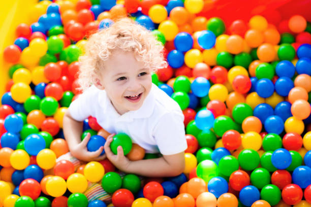 istock Child playing in ball pit on indoor playground 648136380