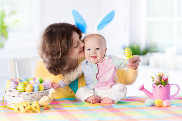 istock Mother and child celebrating Easter at home 648139562