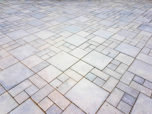 istock decorate of square brick concrete walkway background 648142526