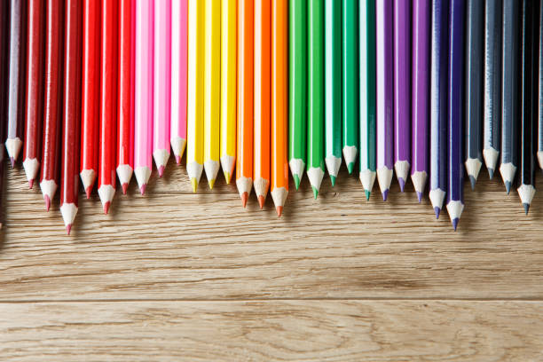 istock Drawing green pencils on a wooden background 648143310