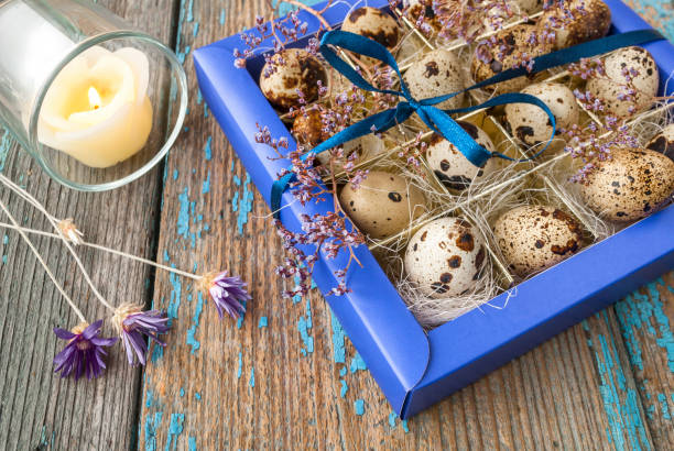 istock Easter Decor quail eggs in box, on a wooden surface 648151610