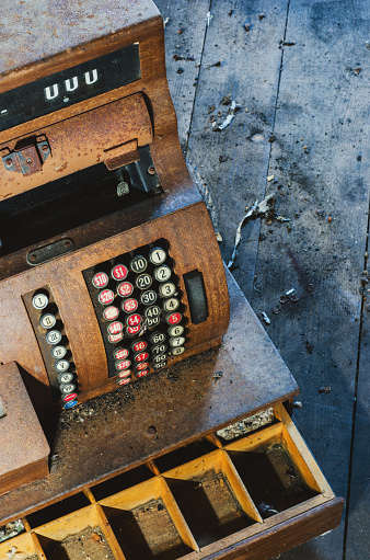 The antique cash register of an abandoned general store.