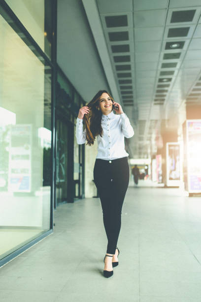istock smiling bussineswoman speaking on mobile 648154800