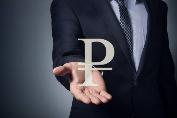 istock hand holds the ruble symbol. 648163288