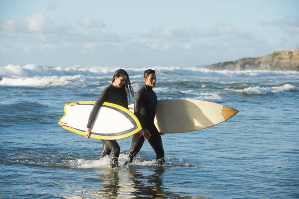 istock Loving Couple With Their Surboards 648163596
