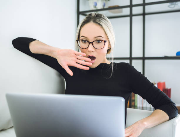 istock Beautiful young woman working with laptop 648192076