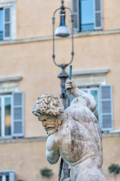 istock Sculpture of a man with spear with a pigeon on the head 648199270