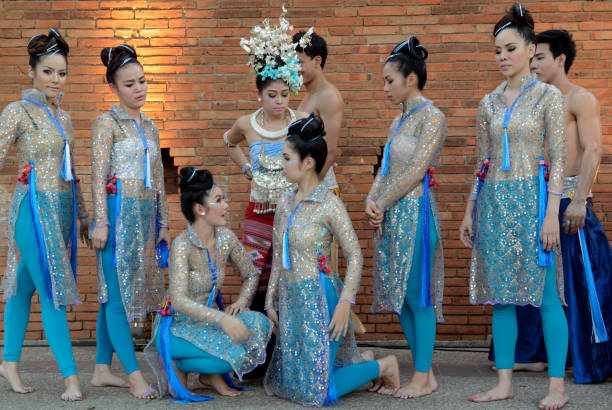 a group of Thai dancers at the Citywalll in the city of chiang mai in the north of Thailand in Southeastasia. \