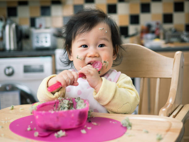 istock eating mess baby girl 648208950