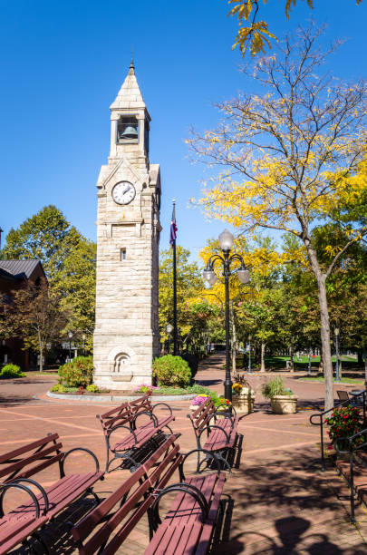 istock Historic Clock Tower in a Square and Blue Sky 648215252