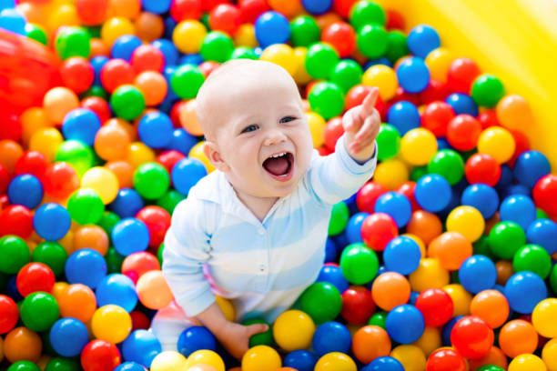 istock Child playing in ball pit on indoor playground 648227196