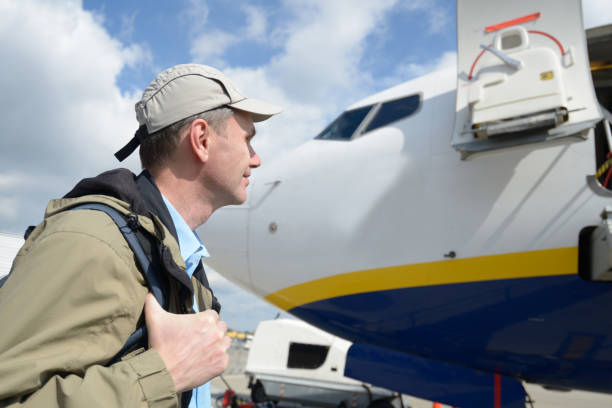 istock Passenger against an aircraft 648227562