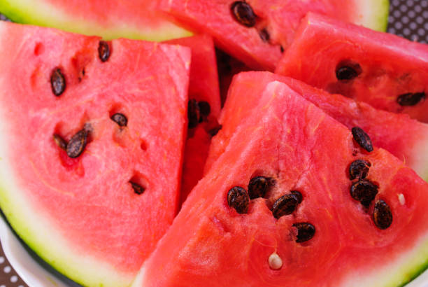 istock Cut pieces of red watermelon on a plate 648232998