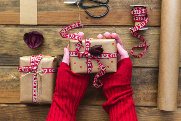 istock Girl's hands holding gift box 648238818