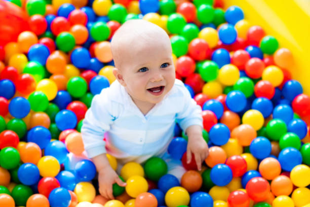 istock Child playing in ball pit on indoor playground 648239678
