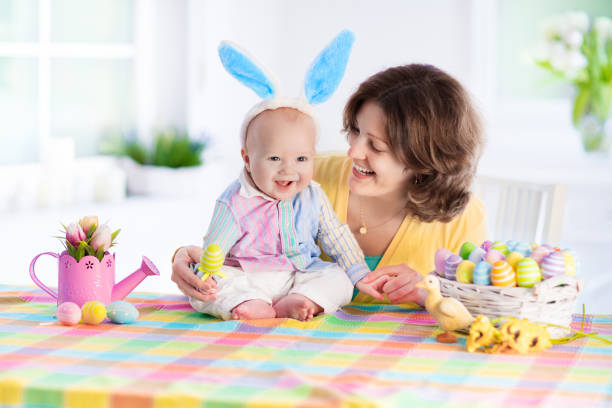 istock Mother and child celebrating Easter at home 648239710