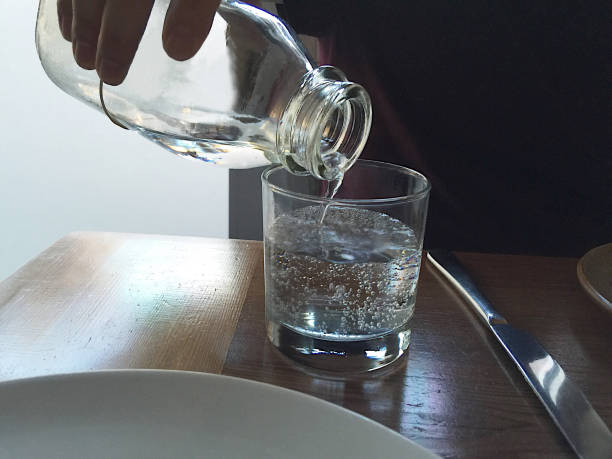 istock Pouring water at restaurant 648247822