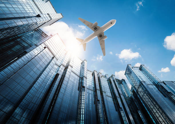 istock airplane flying in city 648248186
