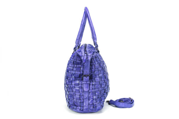 istock Elegant blue handbag sewn from intertwined leather strips isolated on white background, 648255516
