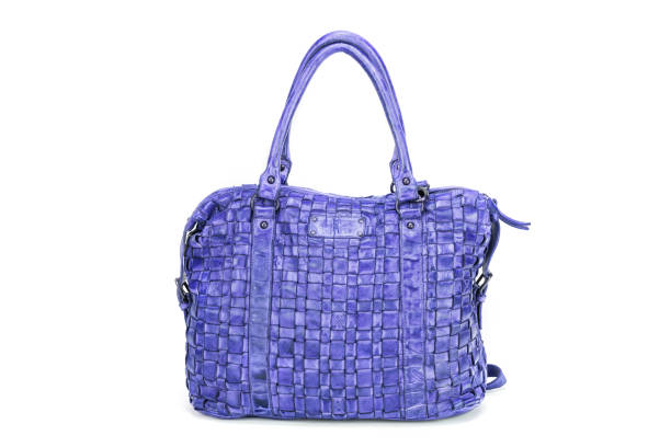 istock Elegant blue handbag sewn from intertwined leather strips isolated on white background, 648255644