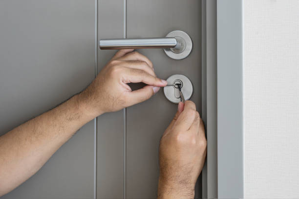 istock locksmith try to fix a key lock door 648268040