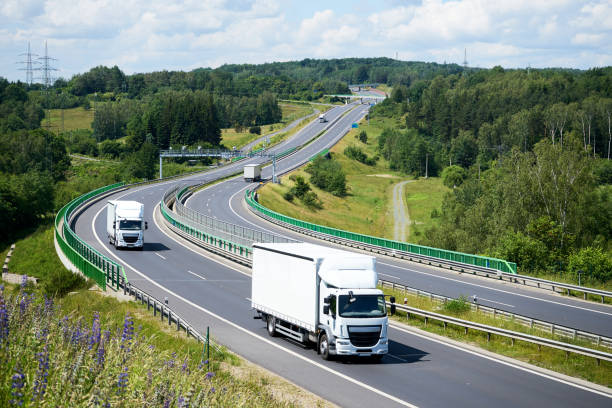 istock White small trucks on the highway with electronic toll gates 648268366