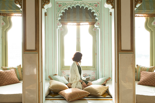 Beautiful woman sitting in comfort relaxing in Udaipur, India.