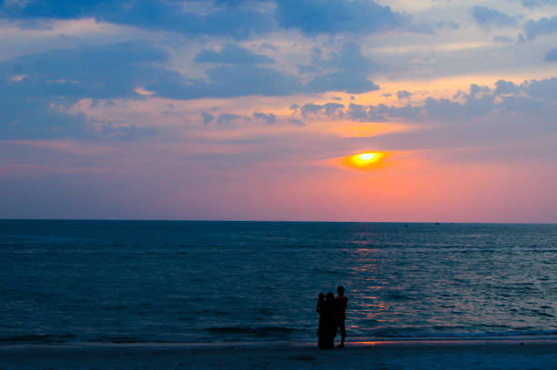 Family silhouette on a tropical beach in langkawi