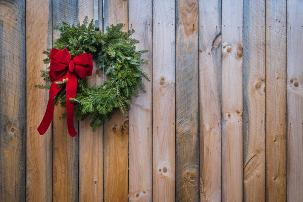 istock Holiday Wreath on Reclaimed Wood Background 648294962