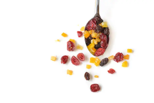 Dried fruits on white background - isolated (Cranberry, raisin and orange)