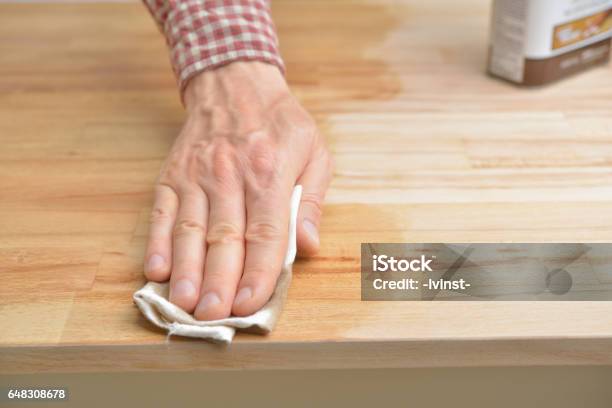 Applying The Danish Oil Stock Photo - Download Image Now - Crude Oil, Wood - Material, Furniture